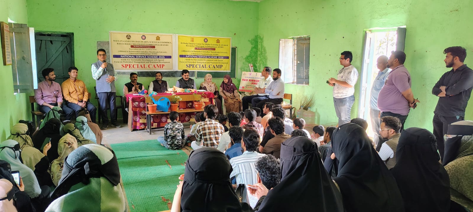 NSS Special Camp activities on Feb 1, 2026: 1. Camp inauguration by Principal Dr. Mazhar Ahmed Farooqui and Dr. Sominath Khade, Director, NSS, DR. BAMU. 2. NSS volunteers participated in cleanliness drive and Swachhta Hi Seva pledge, and conducted a rally in the village. 3. Volunteers prepared and served food to students. 4. Volunteers painted school plants. 5. Awareness program on 