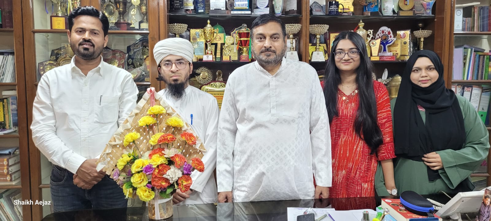 Hon'ble Principal Dr. Mazahar Ahmad Farooqui felicitated Ms. Srushti Kamble (Assistant Professor, Department of English) and Osama Hashmi (MA English student) for qualifying UGC-NET Examination in English.  Dr. Shaikh Kalimoddin Rashid, Head Department of English and Ms. Saudagar Alfiya Samreen are also present on this occasion. 